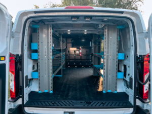 Van with the back door open to show shelving